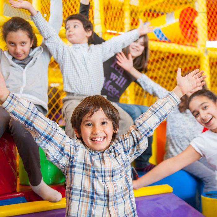 kid on inflatable slide