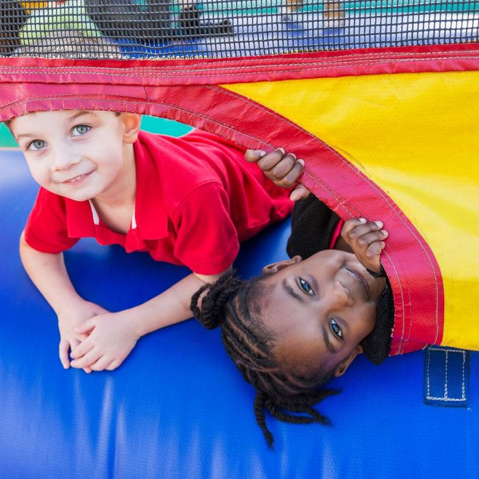 kid on inflatable slide