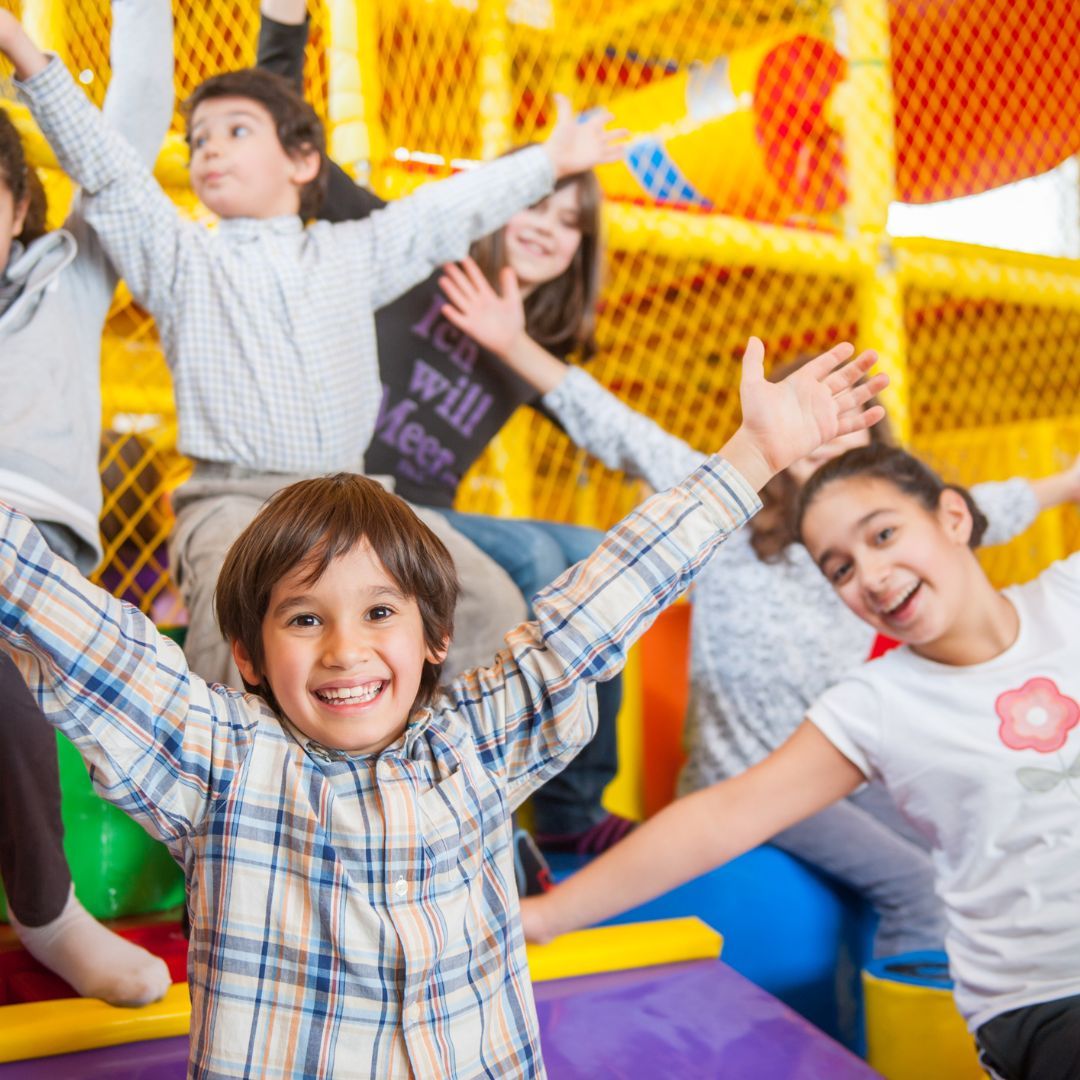 kid on inflatable slide