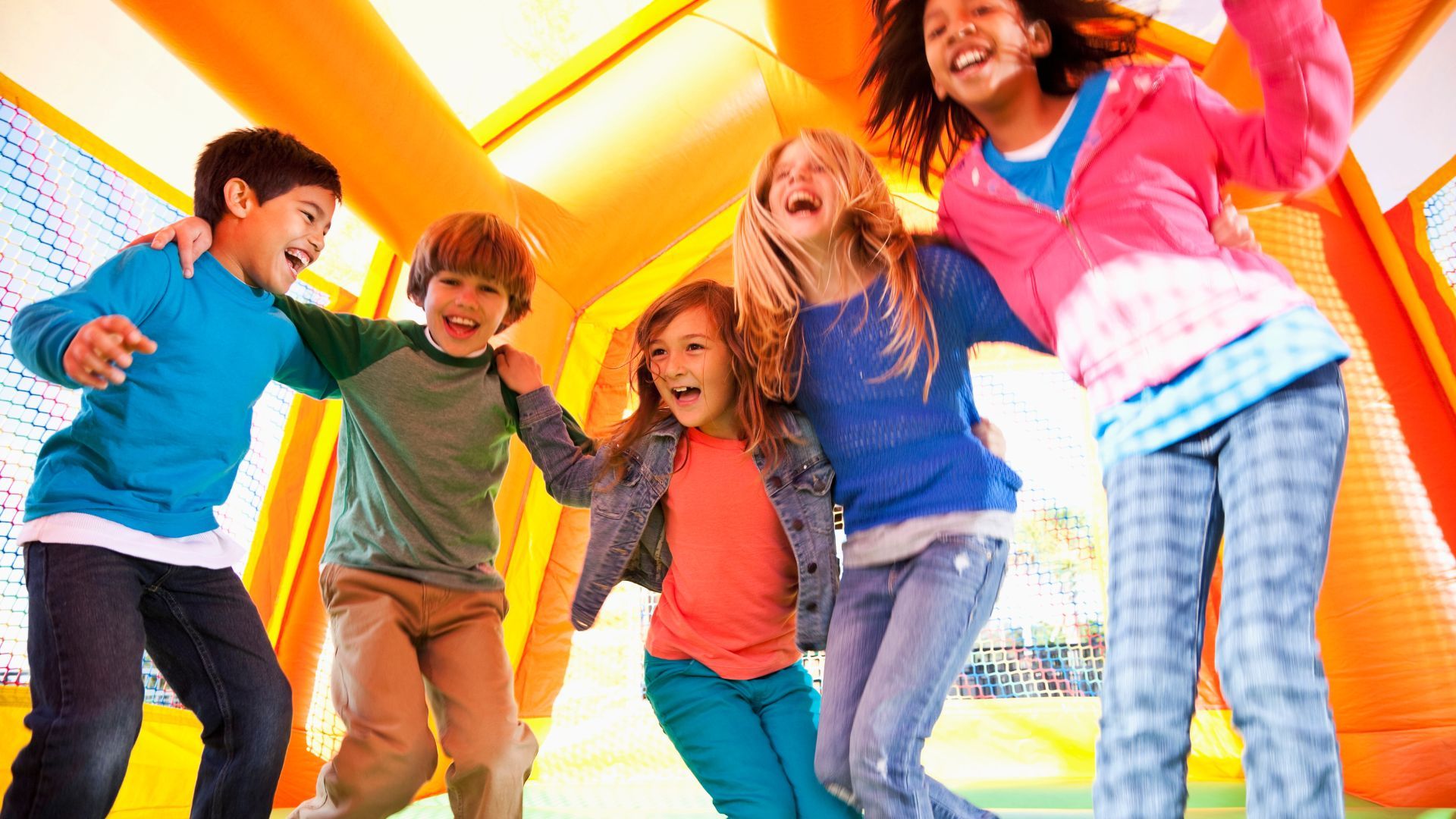 Four children in an inflatable castle. 