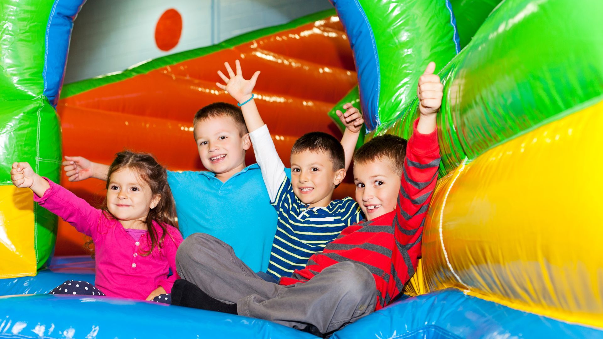 Four children in an inflatable castle. 