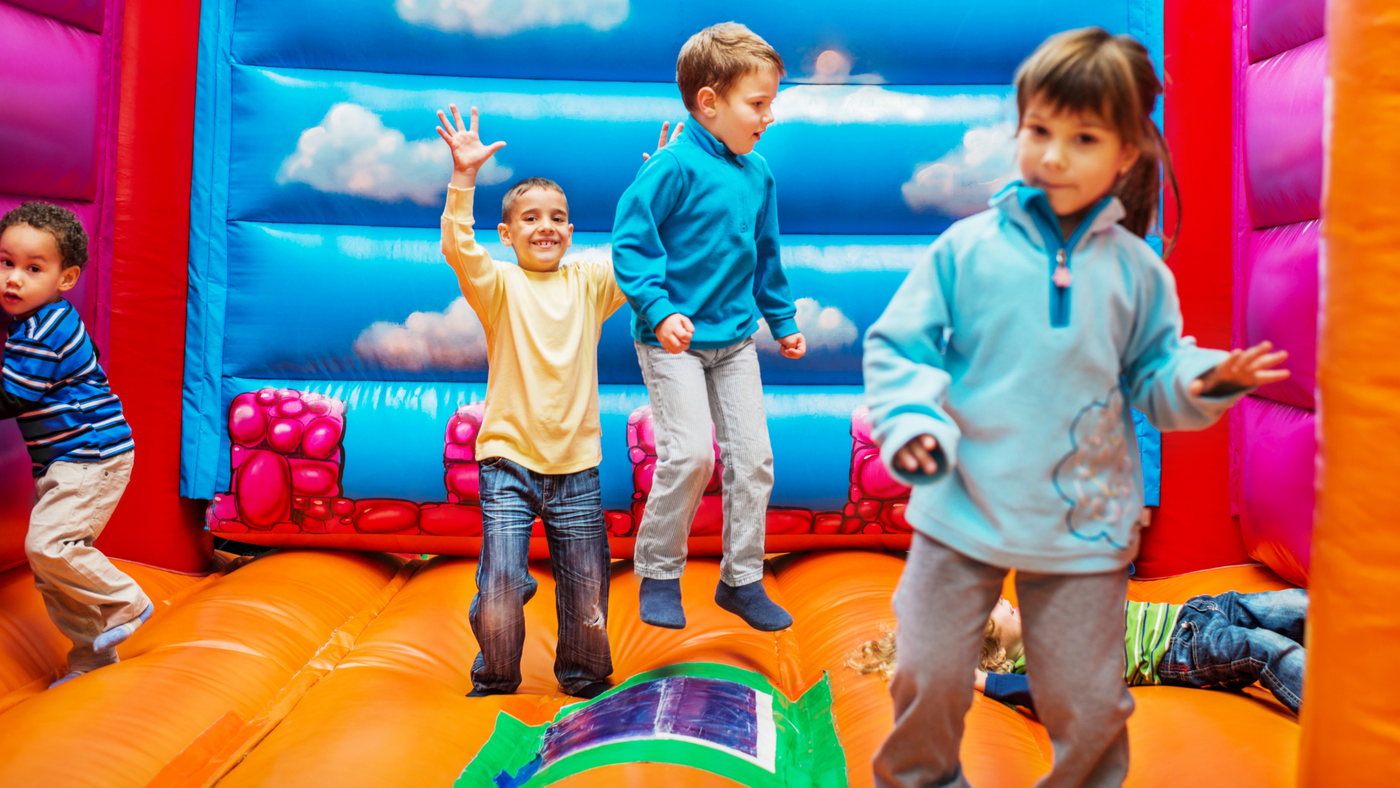 Four children in an inflatable castle. 