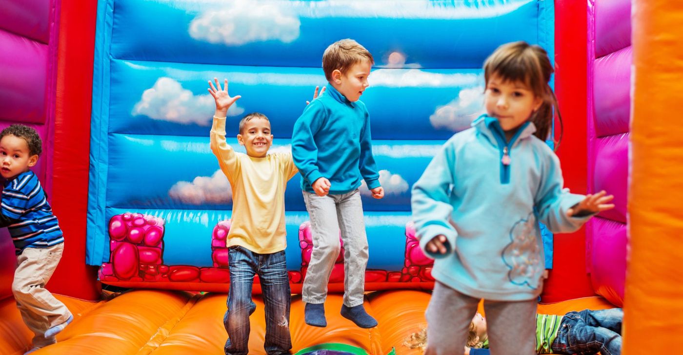 Four children in an inflatable castle. 