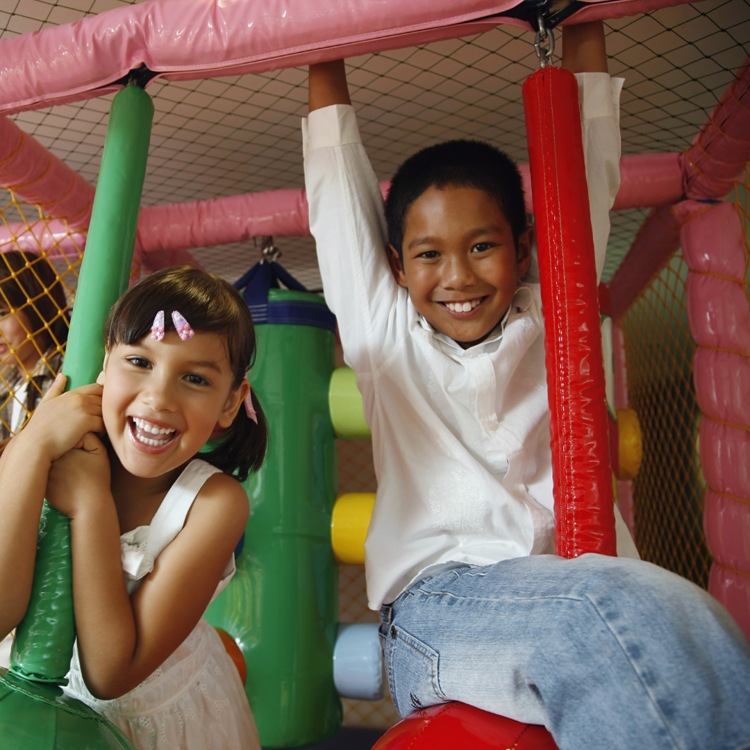 kid on inflatable slide