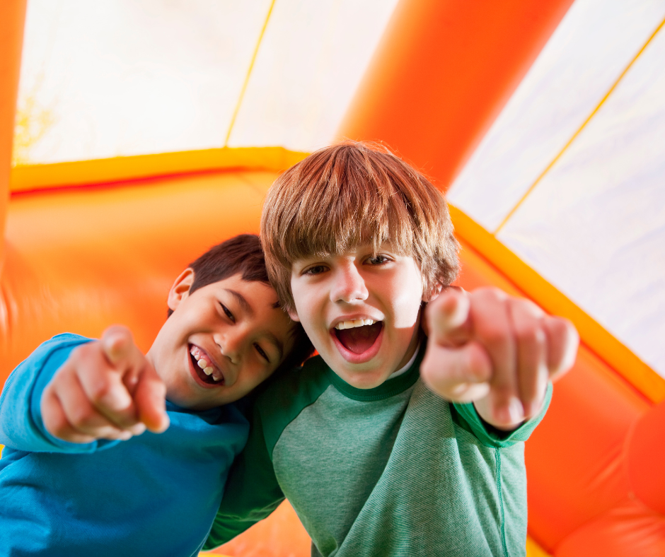 Four children in an inflatable castle. 