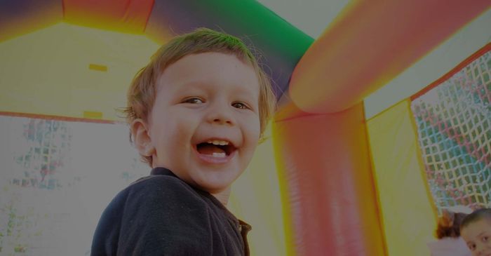 Four children in an inflatable castle. 