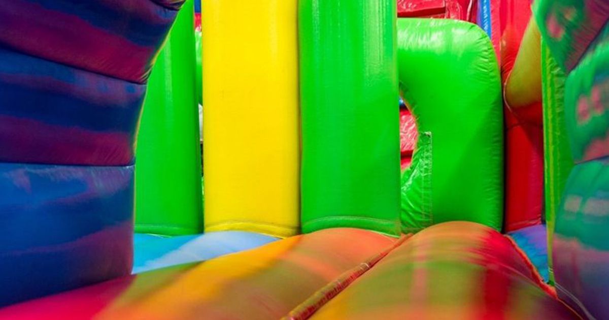 Four children in an inflatable castle. 