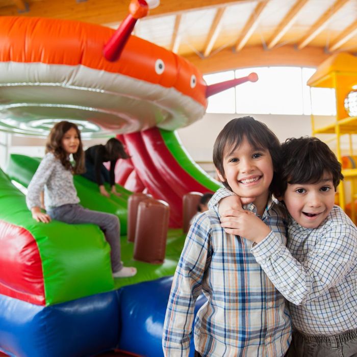 kid on inflatable slide