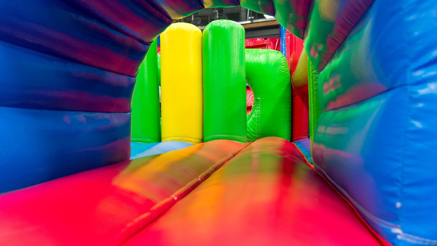 Four children in an inflatable castle. 